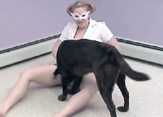 Pigtailed slut in a mask wants dog cock