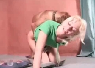 Cute dog enjoying this blonde's holes